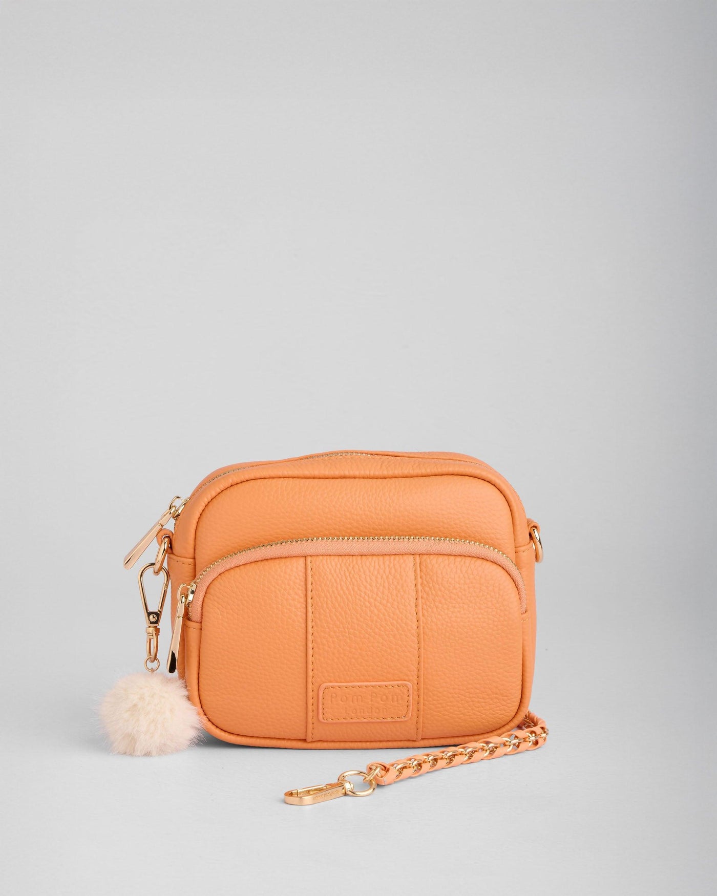 ꕤ︎︎ぽこぽんꕤ︎︎No.145フェザー with minibagチャーム·̩͙꒰ঌ Original Mini Leather Crossbody Bag in Mango Tango | Pom Pom London